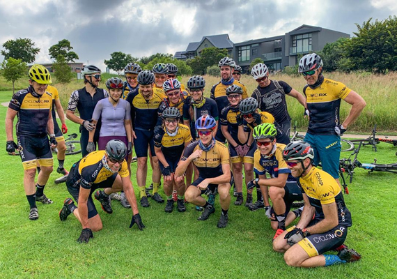 Sneaking in a quick group photo on a weekend MTB ride with the team
